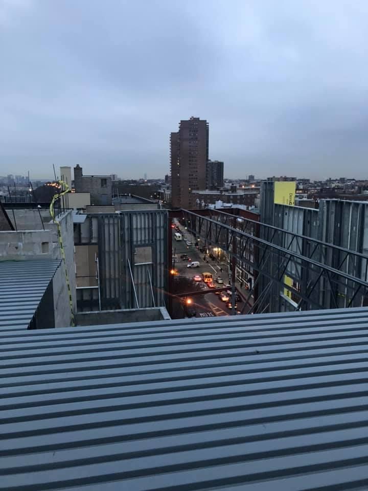 A view of a city from the roof of a building.