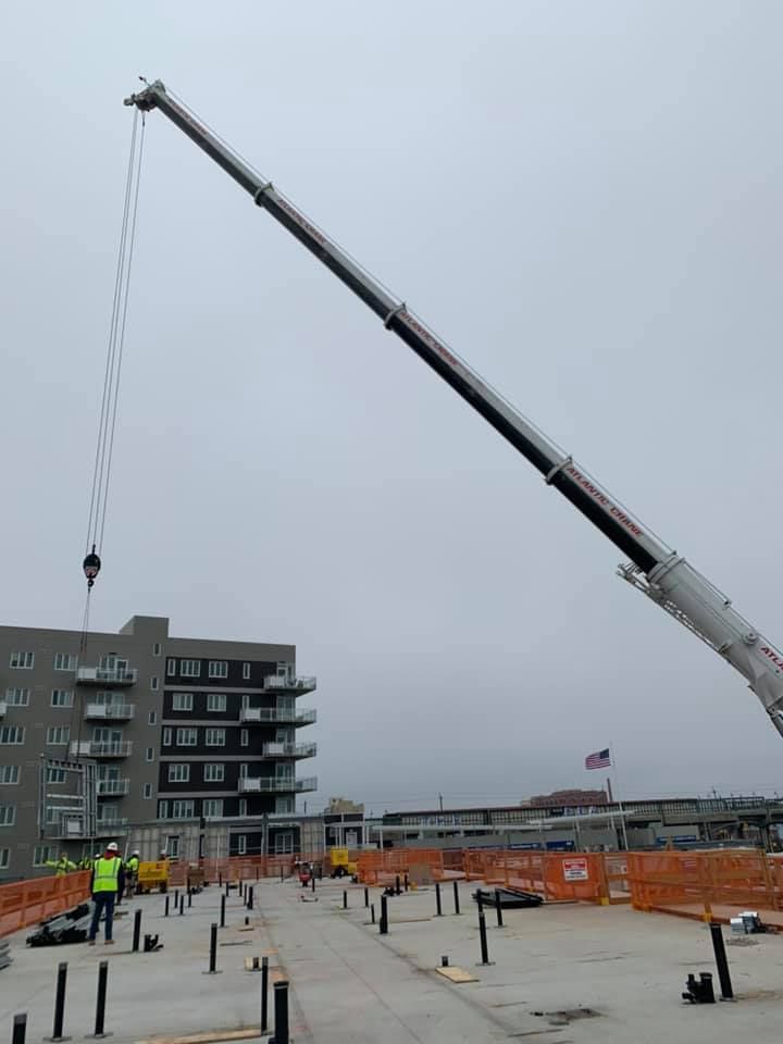 A large crane is being used on a construction site