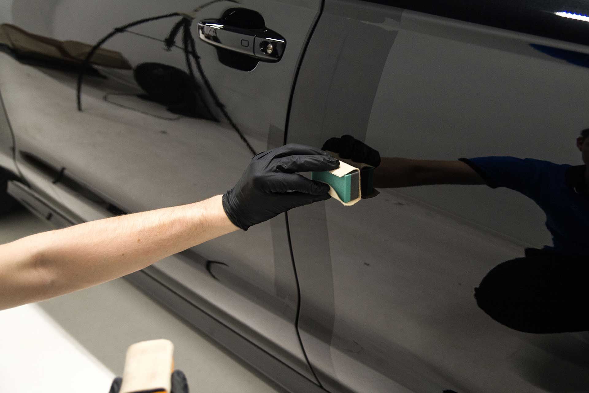 Ceramic coating application process on a black car paint