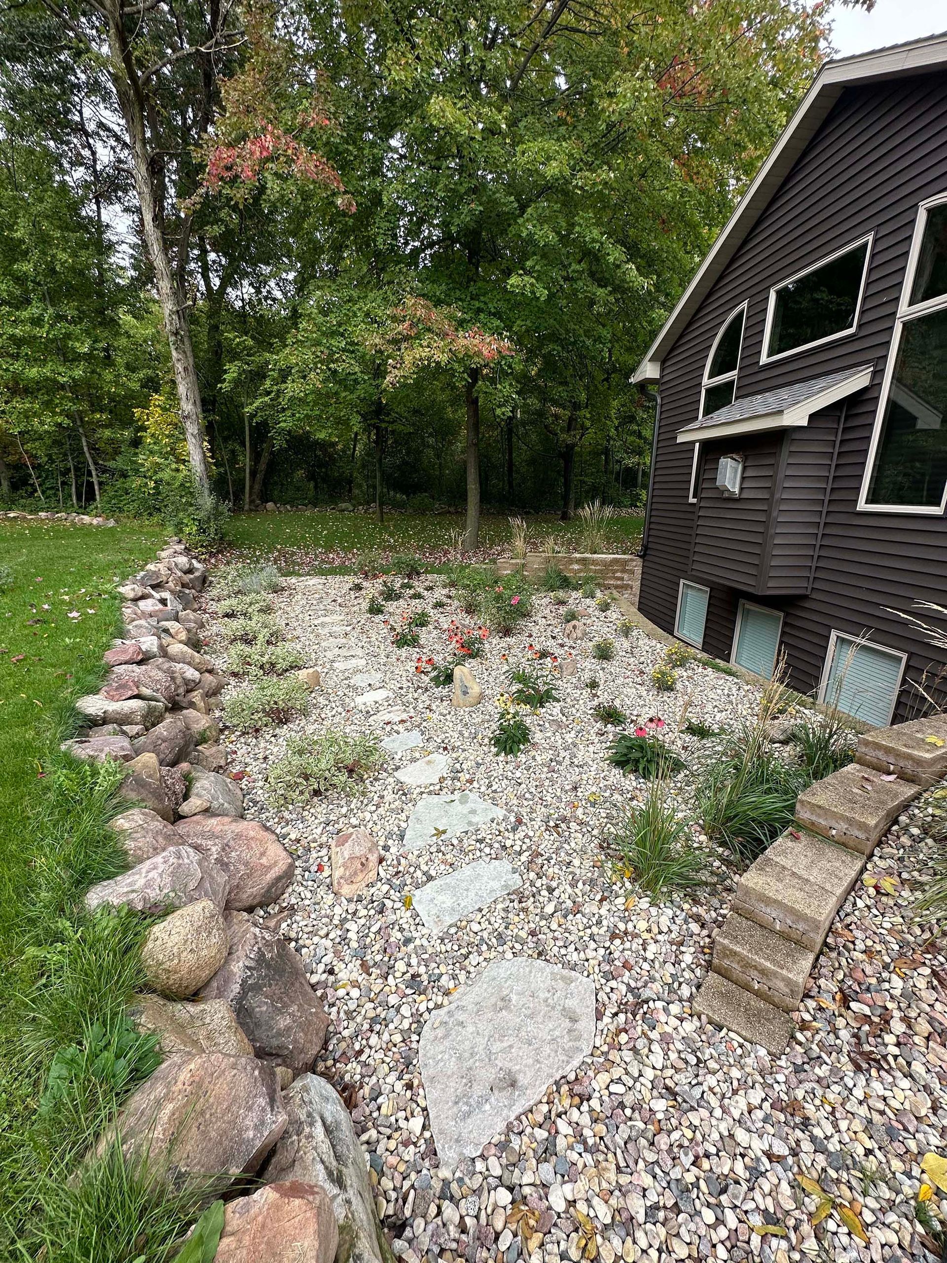 A house with a lot of rocks in front of it.