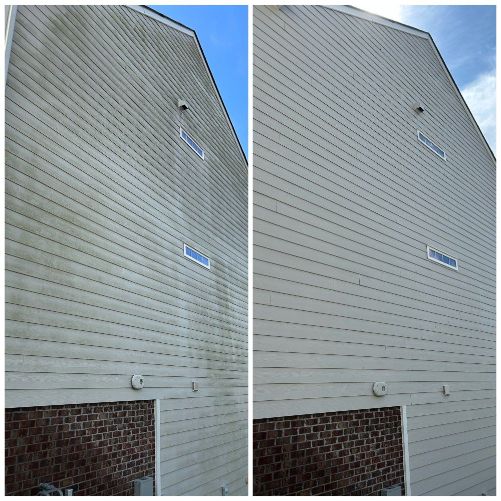 Side-by-side comparison of a building's siding before and after power washing. The clean siding is much brighter.