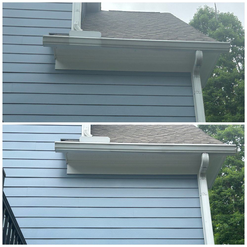 Comparison of a house's upper wall and gutters, showing a before-and-after cleaning. Blue siding and white gutters.
