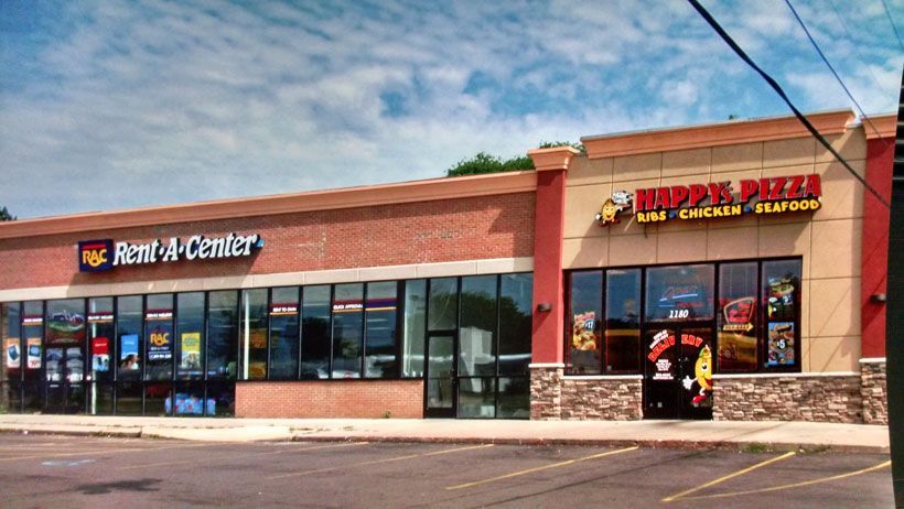 A building with a sign that says Rent-a-Center