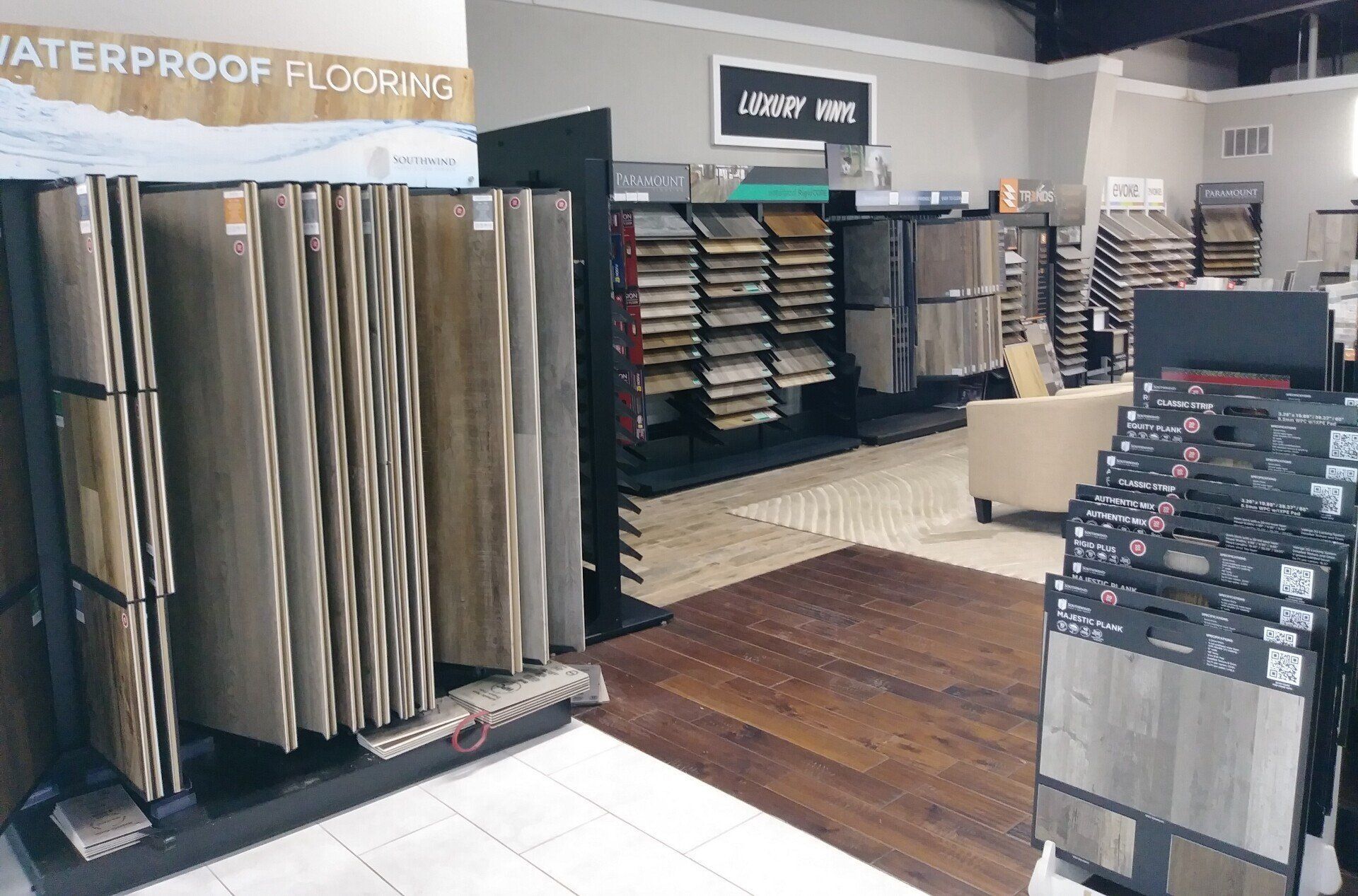 a store filled with lots of different types of flooring .