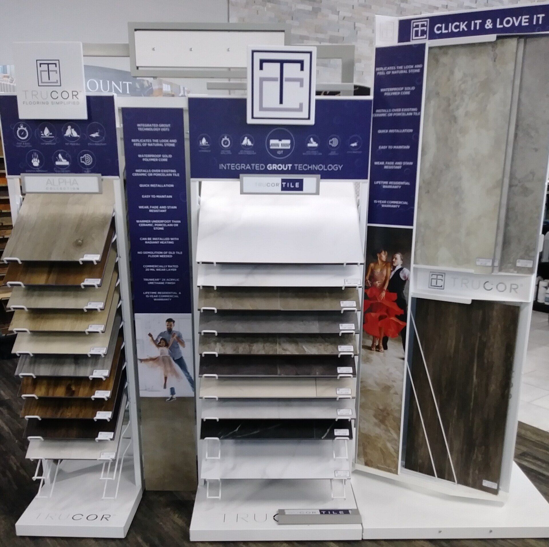 a display of different types of flooring with a sign that says click it & love it