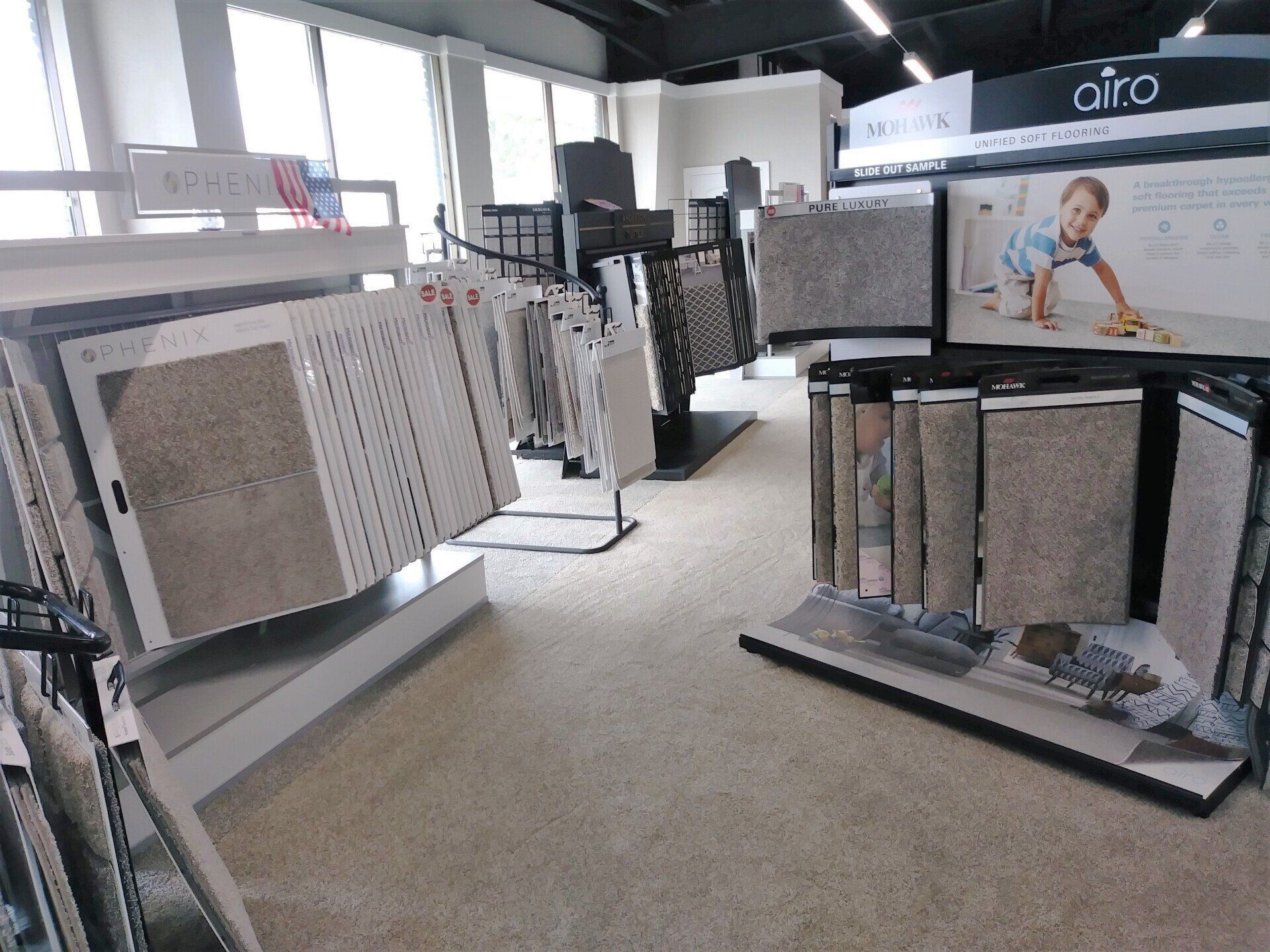 a showroom filled with lots of carpets and tiles .