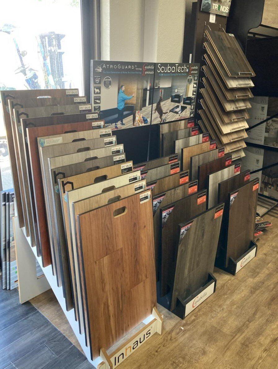 a display of different types of wood flooring in a store .