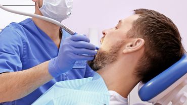 Extraction of man's teeth