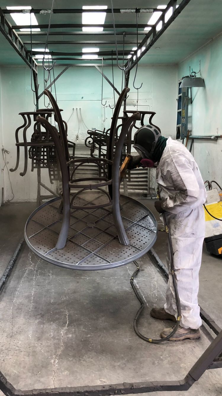 man doing powder coating