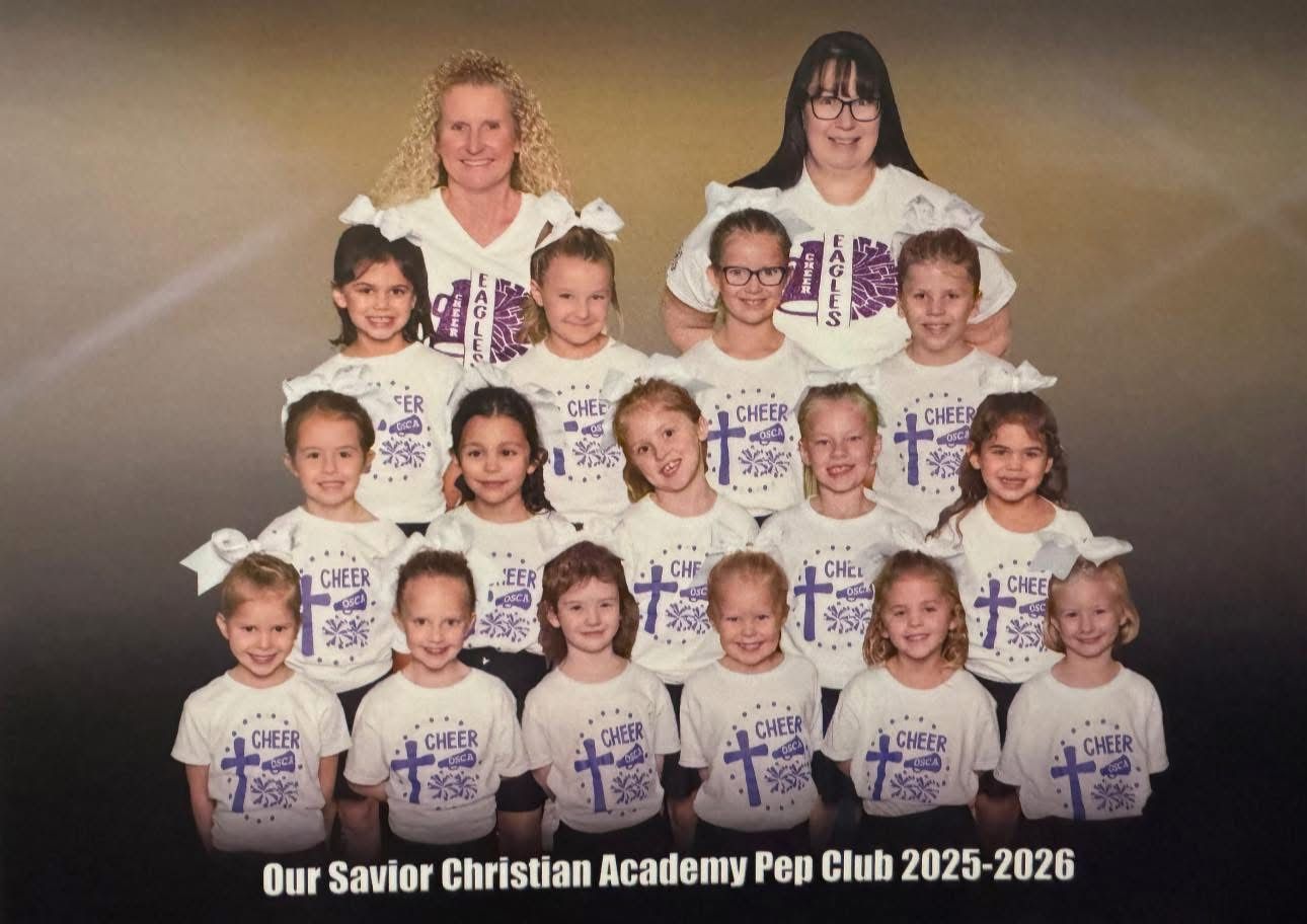 A group portrait of the Our Savior Christian Academy Pep Club 2025-2026, posing in white matching team shirts.