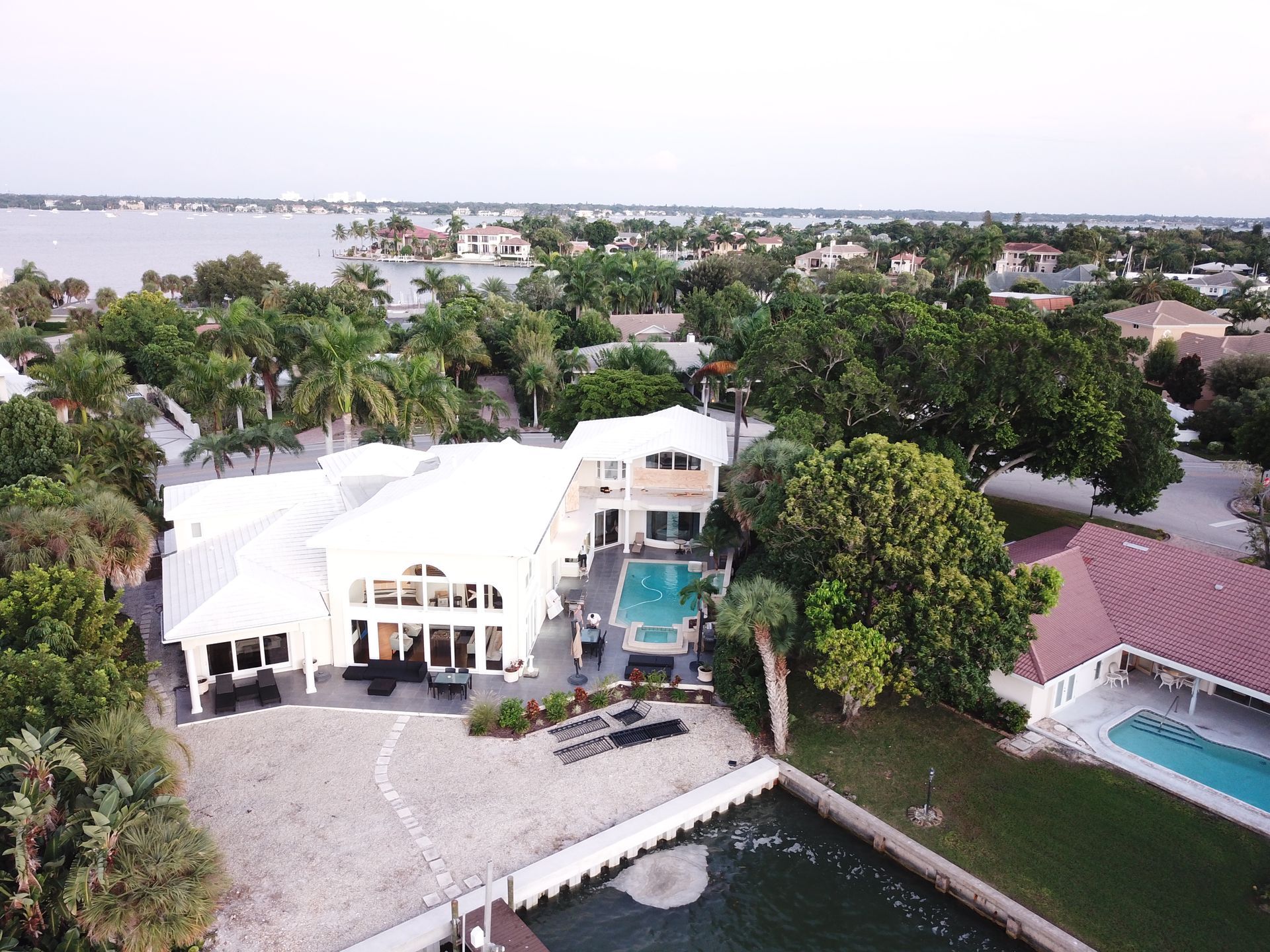 An aerial view of a large house with a pool