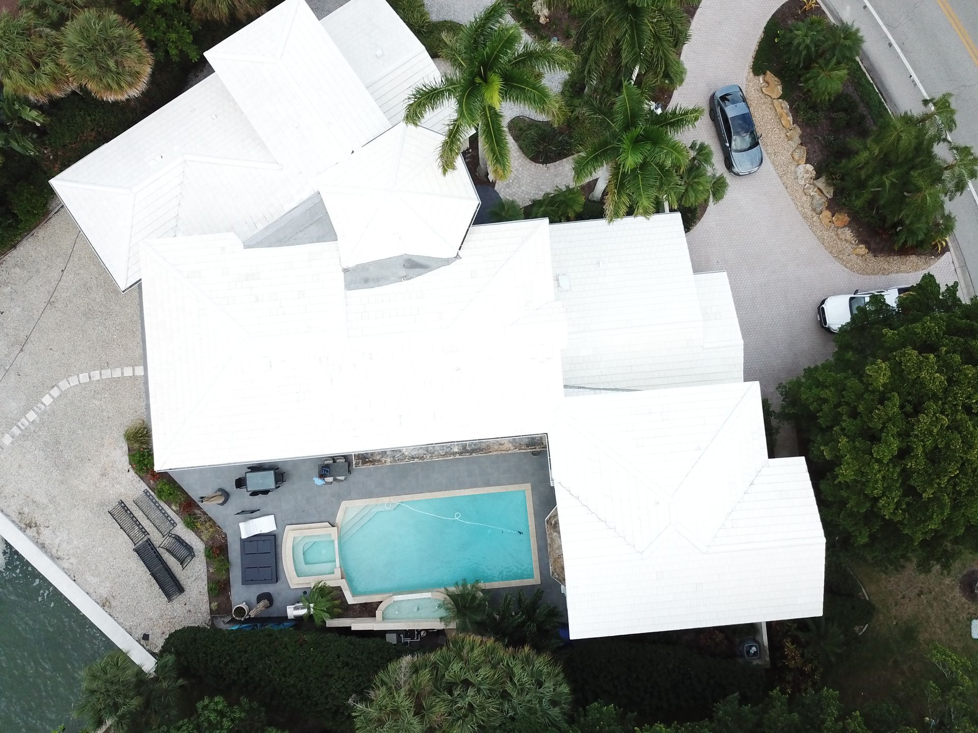 An aerial view of a house with a swimming pool