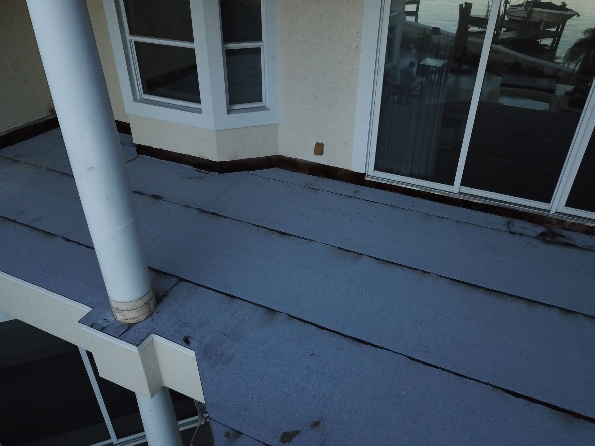An aerial view of a balcony with a sliding glass door