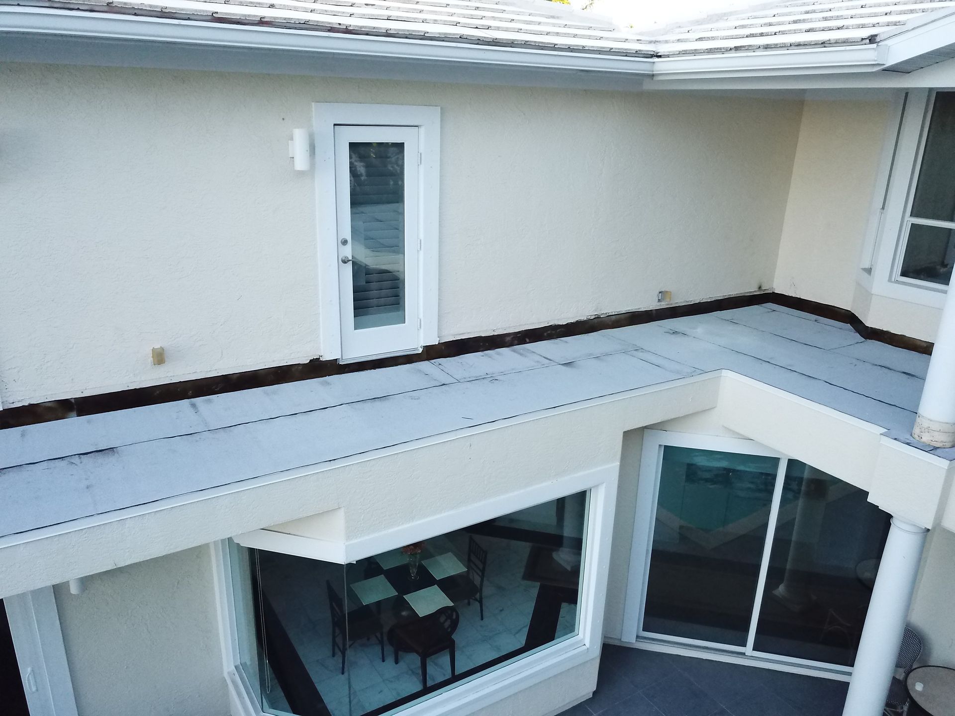 An aerial view of a house with a sliding glass door
