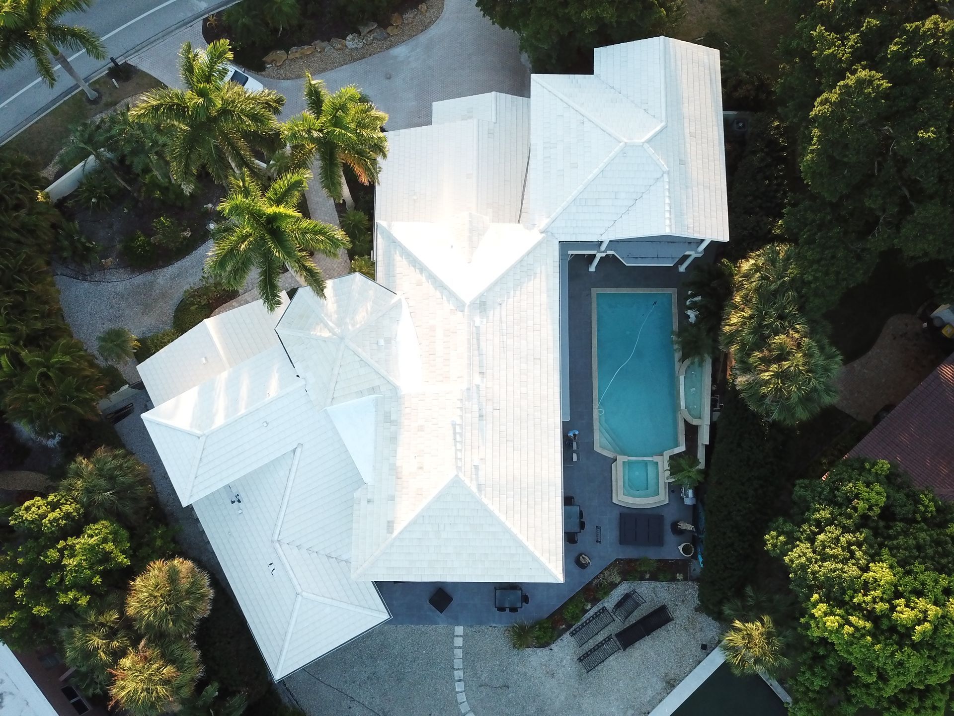 An aerial view of a house with a pool
