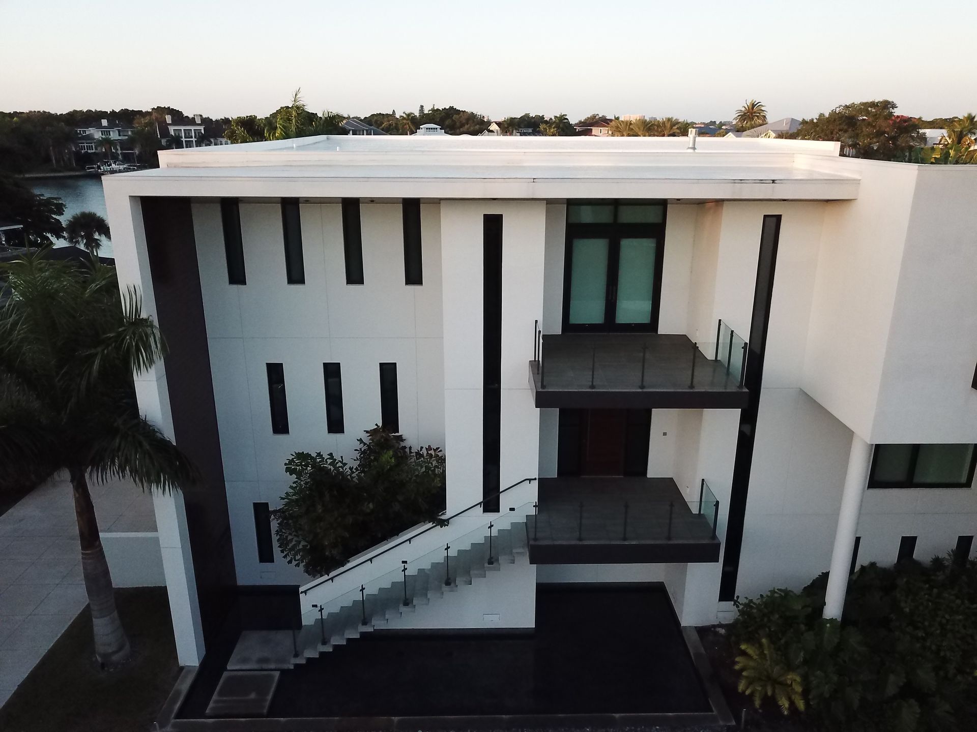 An aerial view of a large white house