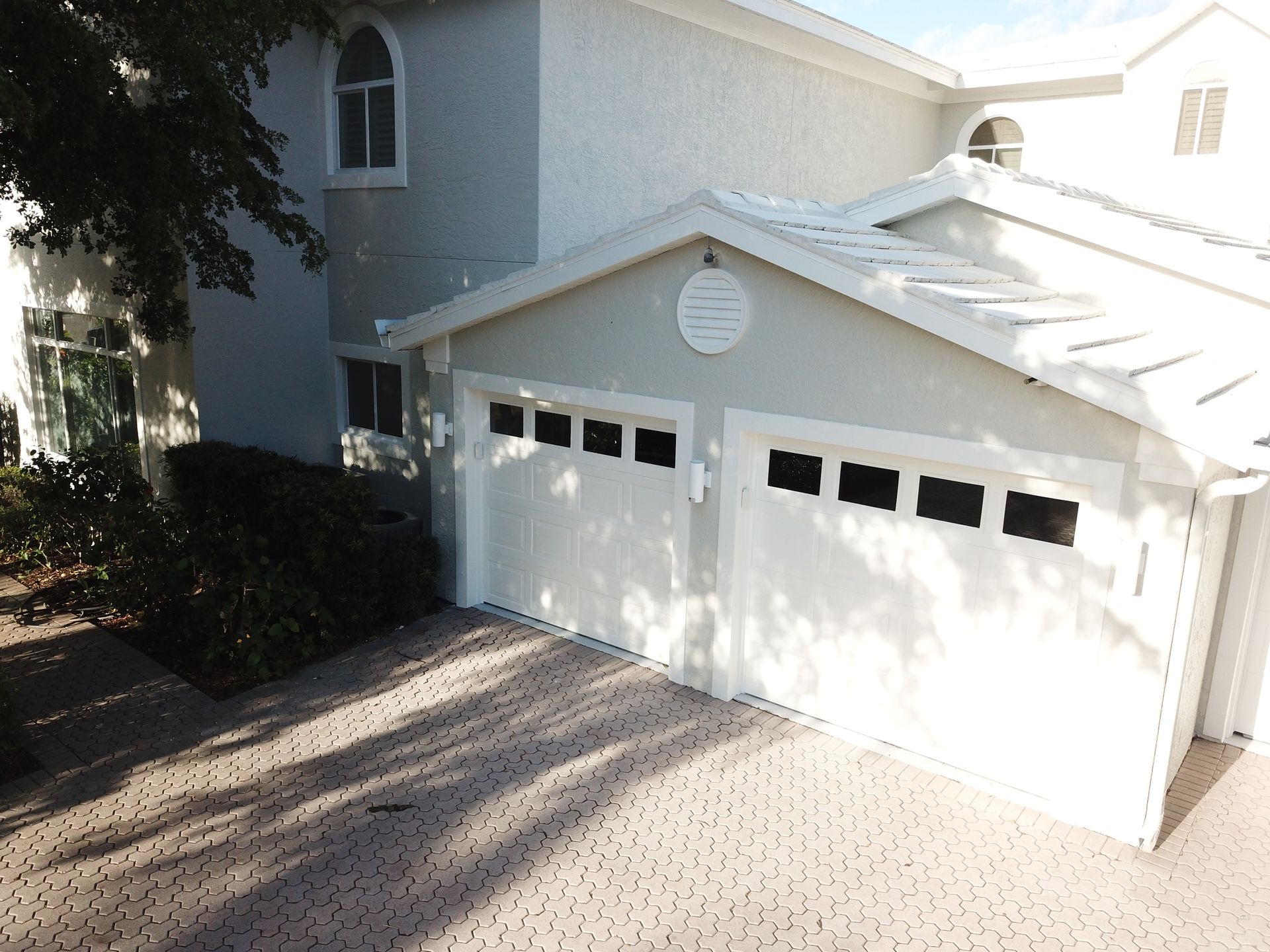 An aerial view of a house with two garage doors