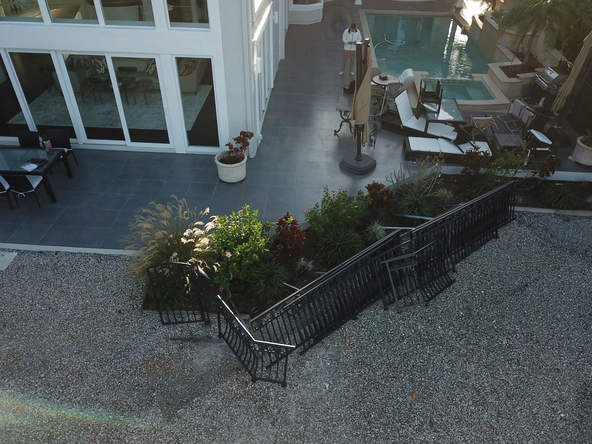 An aerial view of a house with a swimming pool