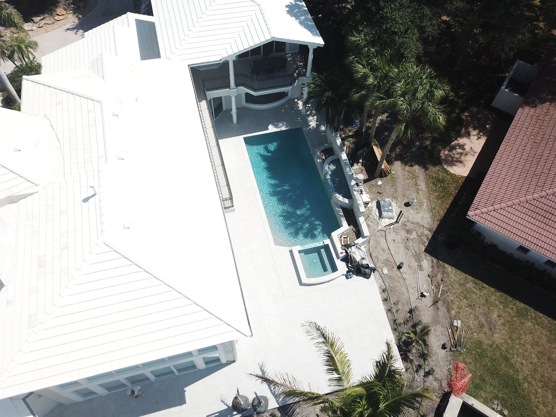 An aerial view of a house with a swimming pool