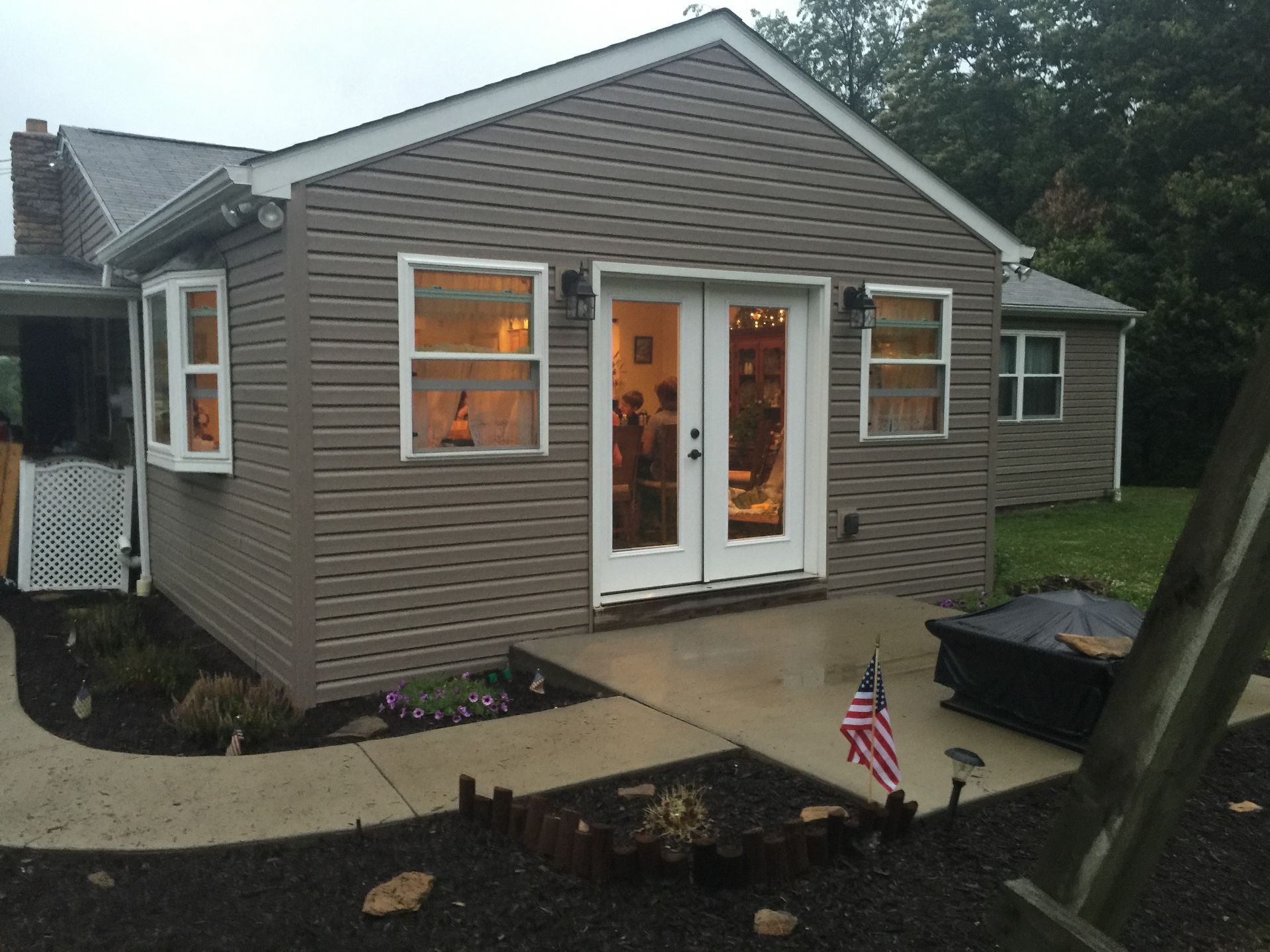 A small house with a walkway leading to it