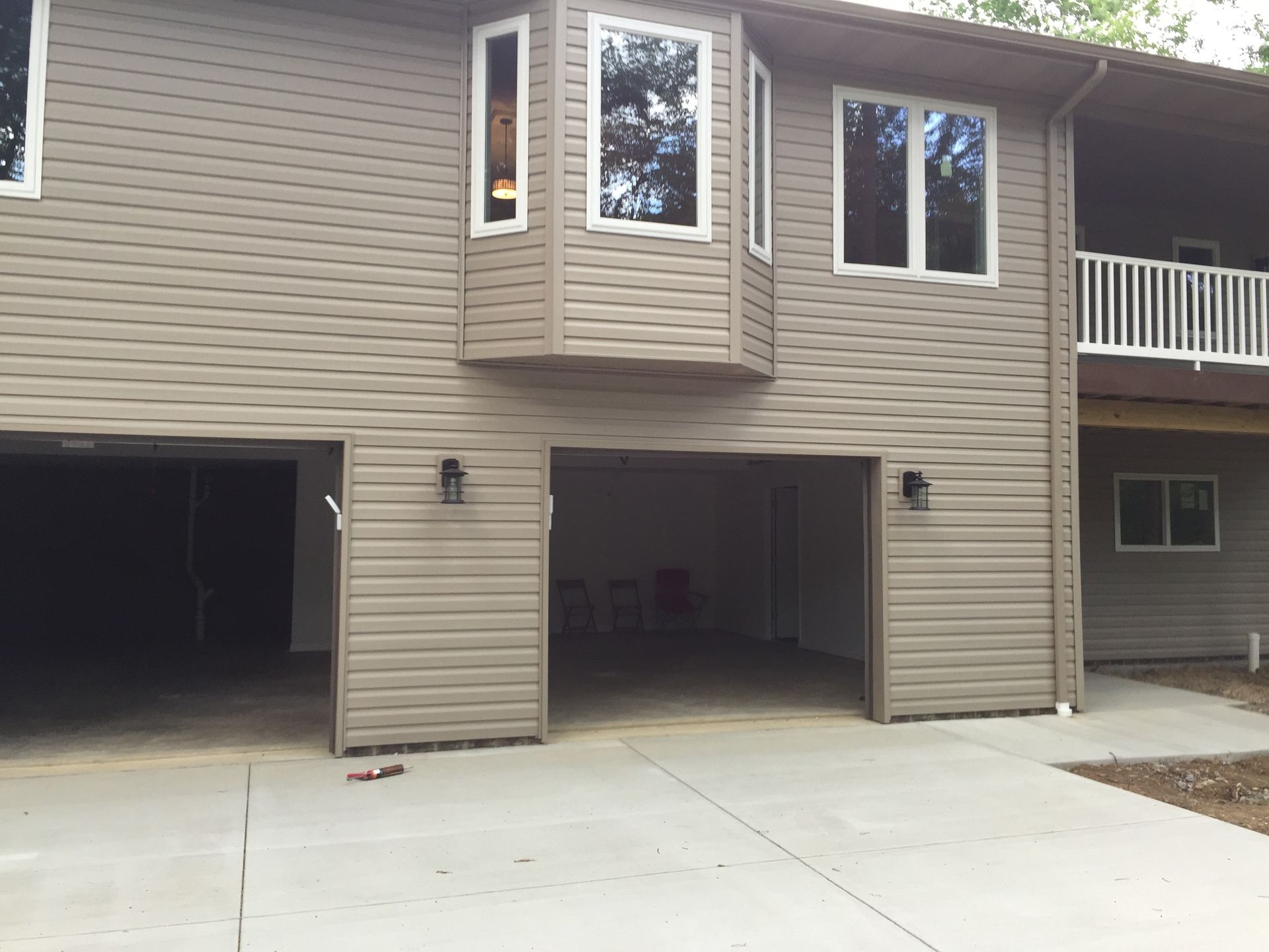 A large house with a garage and a balcony