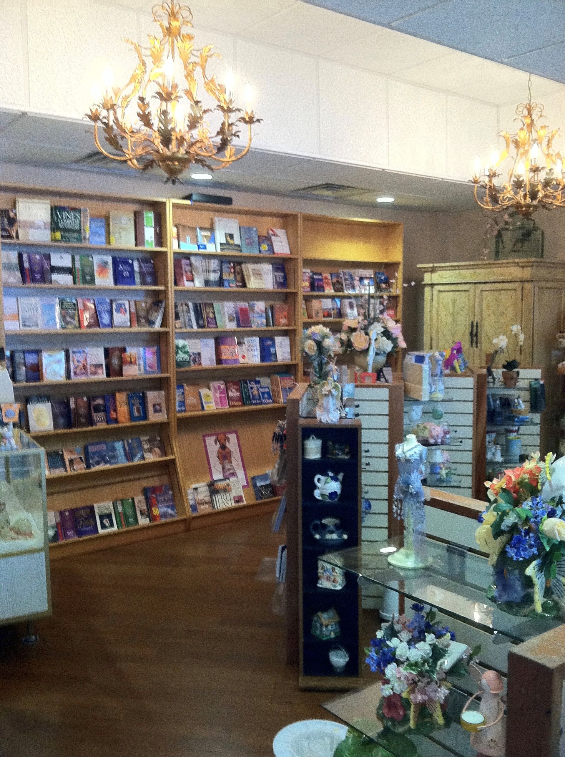 A bookstore filled with lots of books and flowers