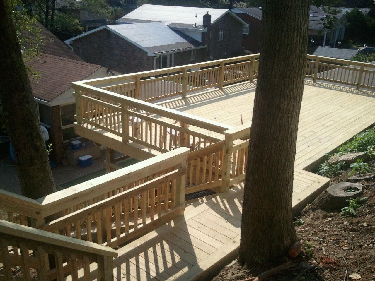 A wooden deck with stairs leading up to it