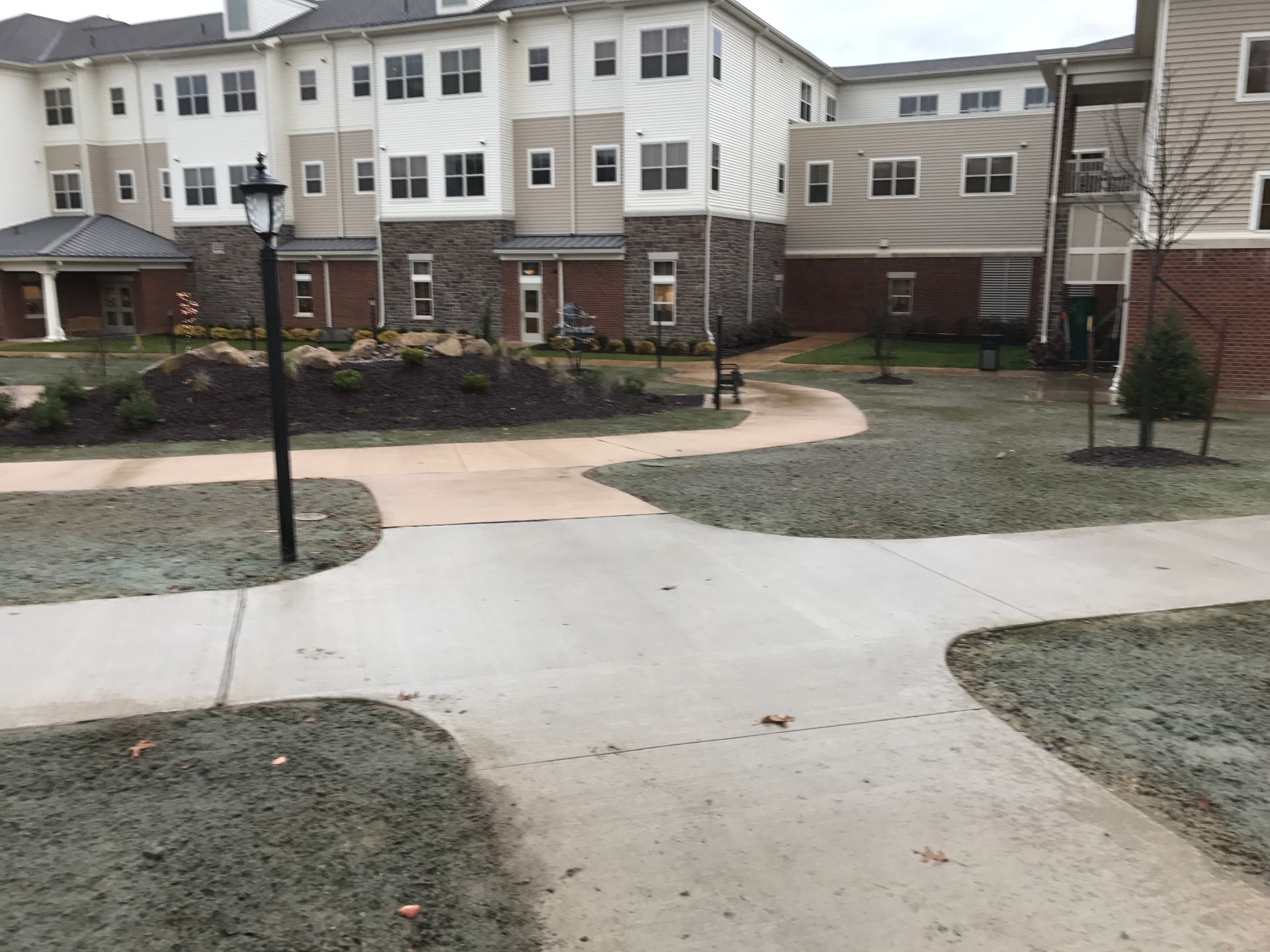 A large building with a walkway in front of it