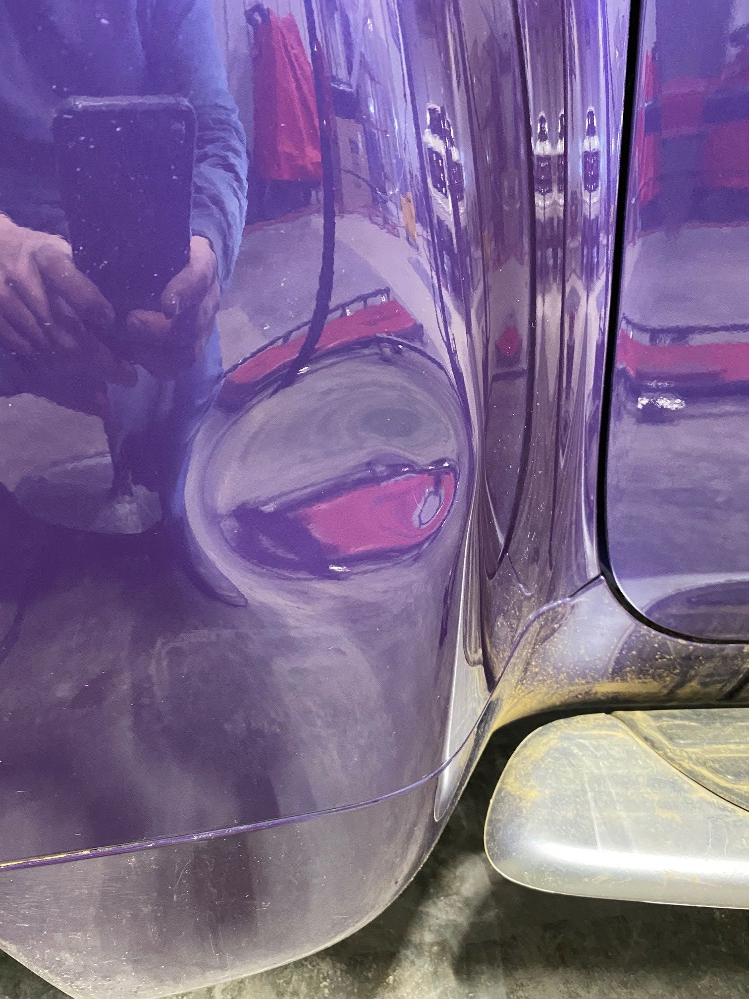 Before image of auto body damage showing dents