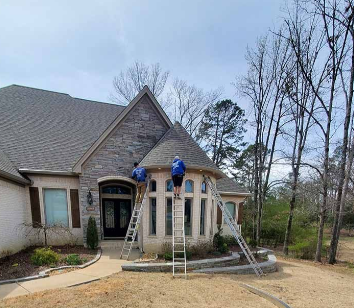 Front entrance of a house with blue balloons and a ladder under a cloudy sky