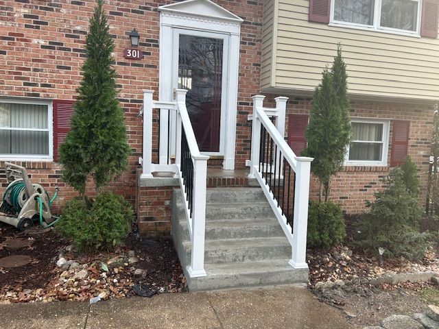 A brick house with a white porch