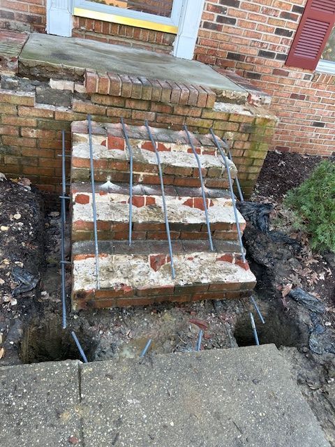 A staircase is being built in front of a house