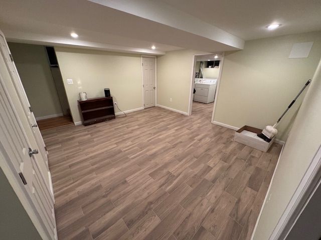 A room with hardwood floors and a mop in it