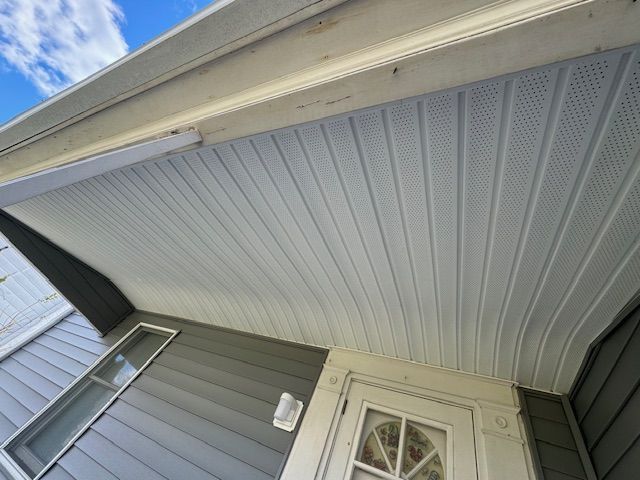 Looking up at the ceiling of a house with a door.