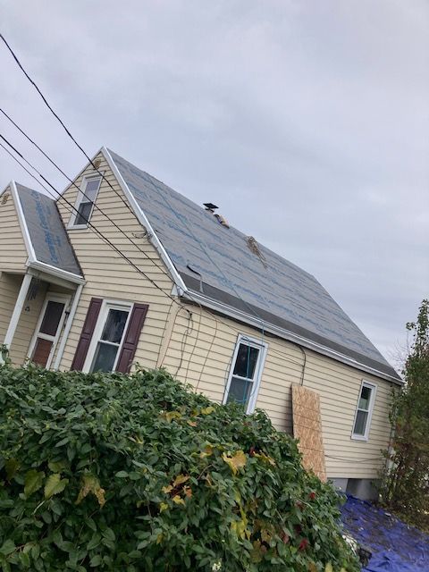 A house with a roof that is covered in shingles