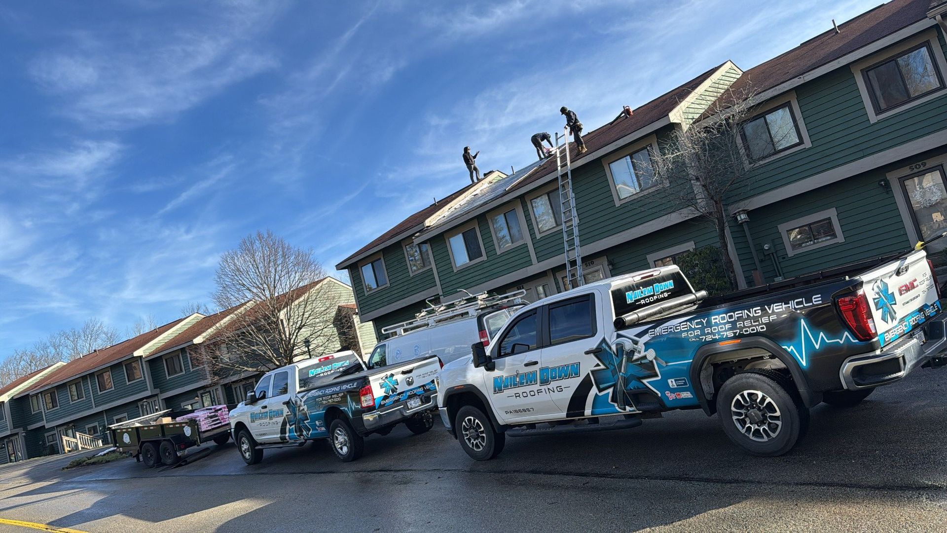 A row of trucks parked in front of a building.