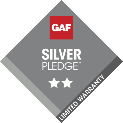 A logo for a silver pledge limited warranty