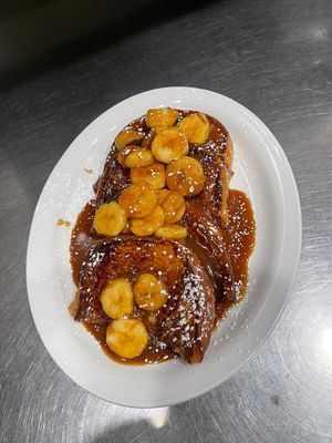 A white building with cars parked in front of it