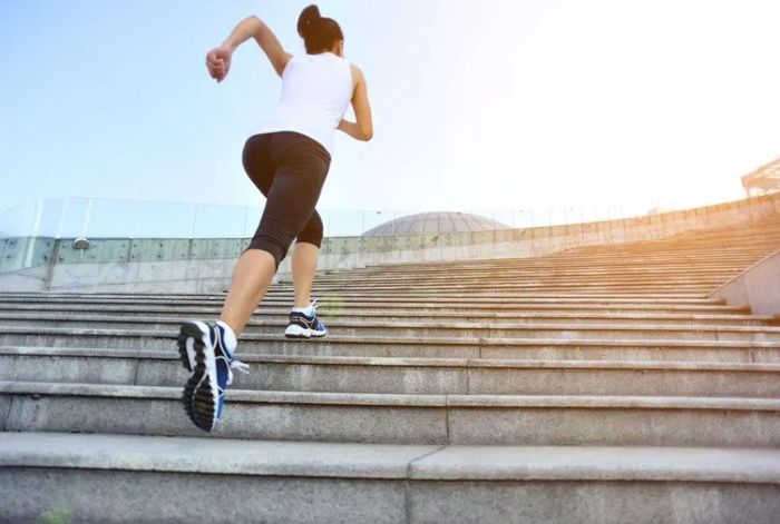 athlete running on stairs