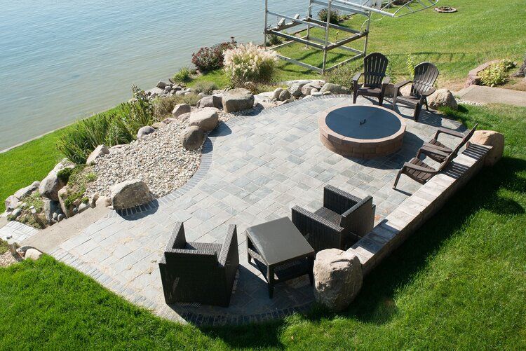 There is a fire pit in the middle of the patio.