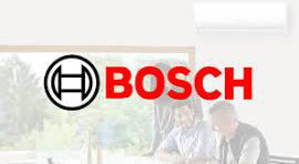 Bosch logo in red and black over a faint blurred background of people indoors