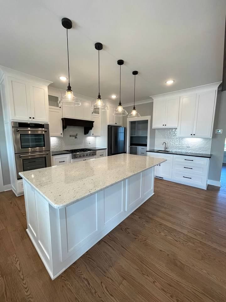 There is a large island in the middle of the kitchen