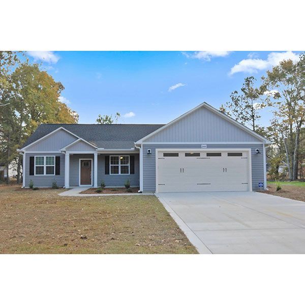 A house with a large garage and a driveway
