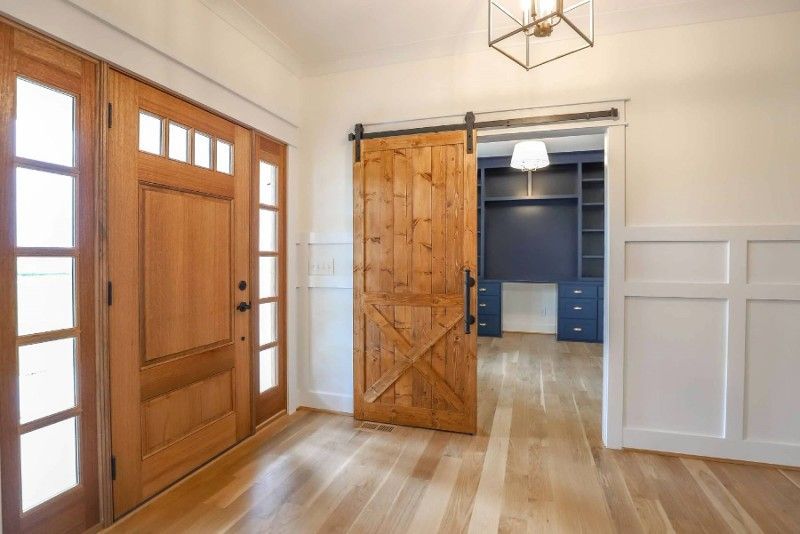 There is a sliding barn door in the middle of the room.